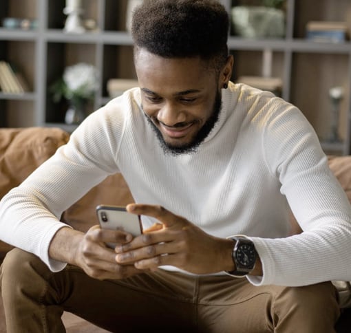 Image of a man looking at his mobile phone